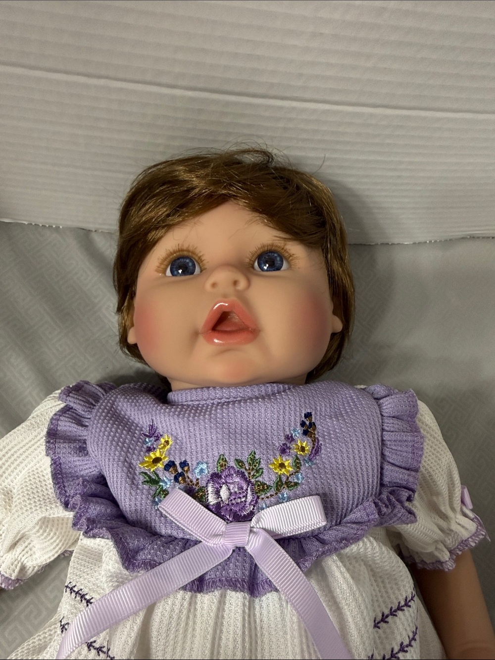 Aori Reborn Lifelike Baby Girl Doll in Lavender Embroidered Outfit Soft Body - Picture 2 of 10
